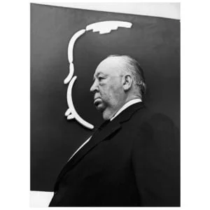 een zwart-witfoto van een man in een pak