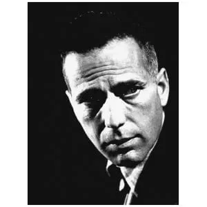 een zwart-witfoto van een man in een pak