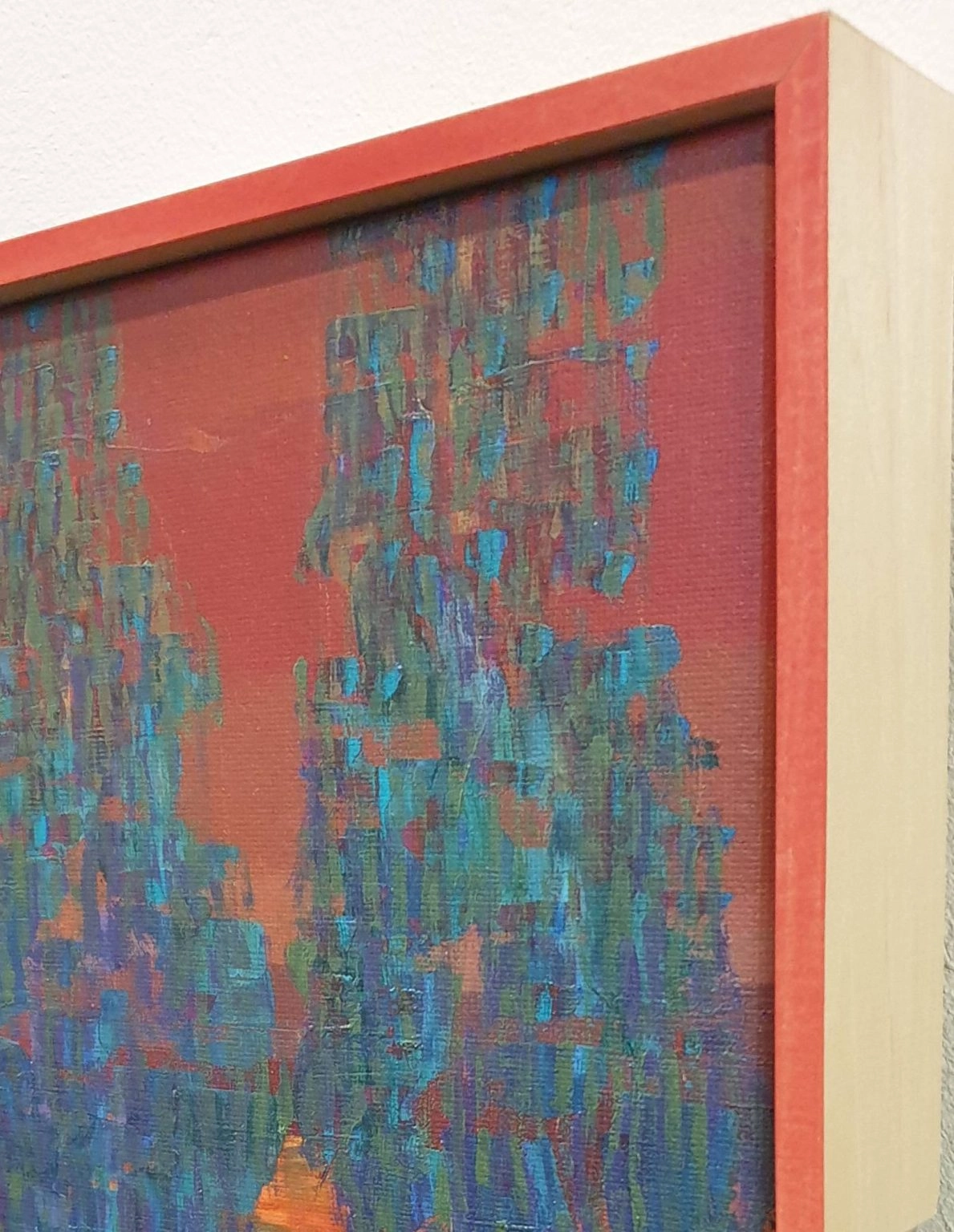 een abstract schilderij met blauwe en rode kleuren