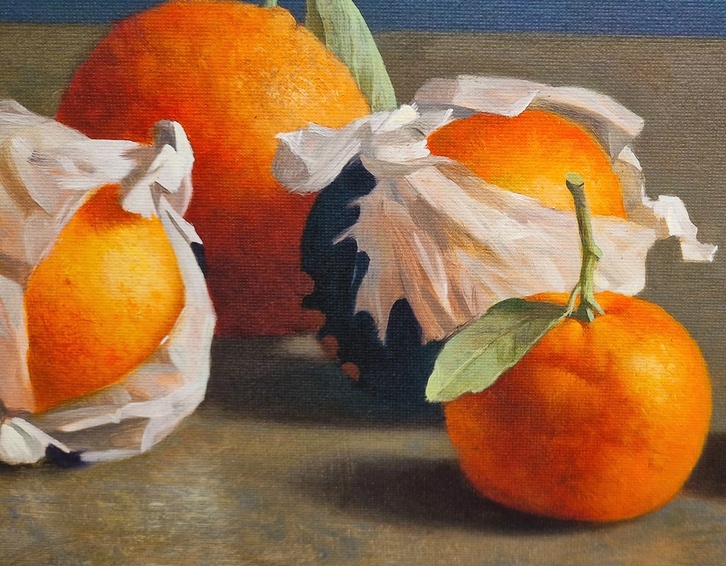 twee sinaasappels met bladeren erop zitten naast elkaar