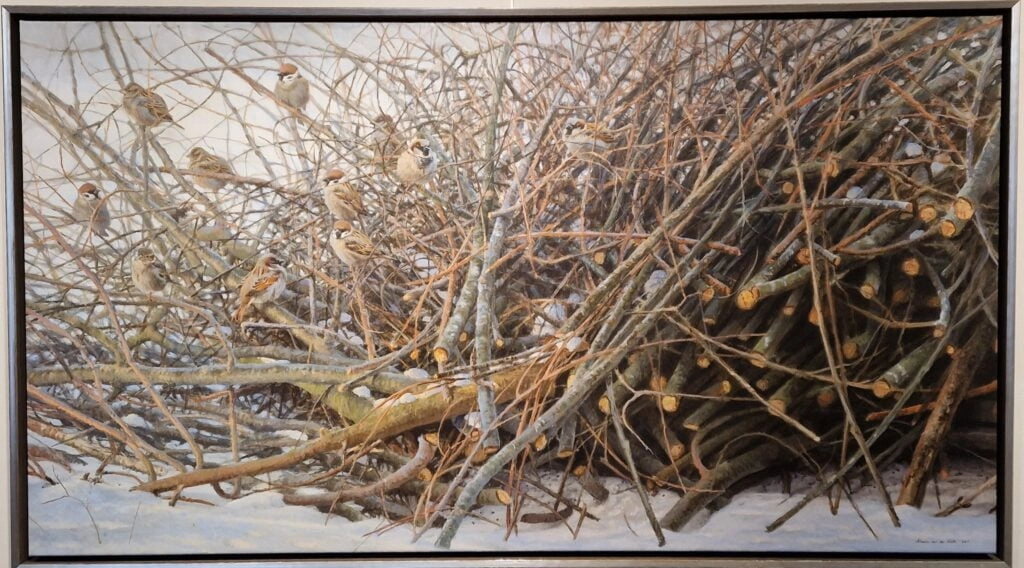 een schilderij van takken en twijgen in de sneeuw