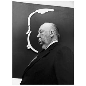 een zwart-witfoto van een man in een pak
